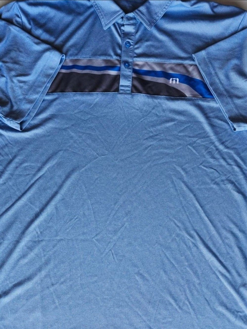 Travis Mathew Light Blue Polo with Navy and Royal Stripe Panel